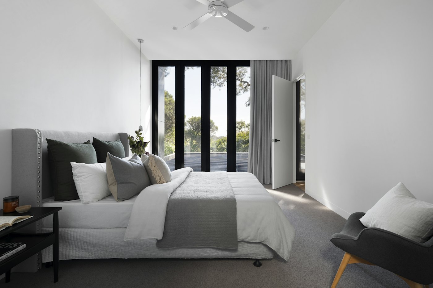 A serene contemporary bedroom with soft natural light